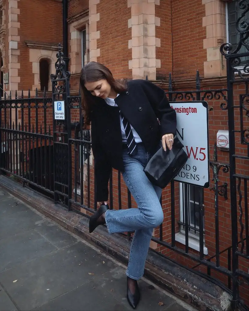 Black blazer with tie and light wash jeans in Kensington