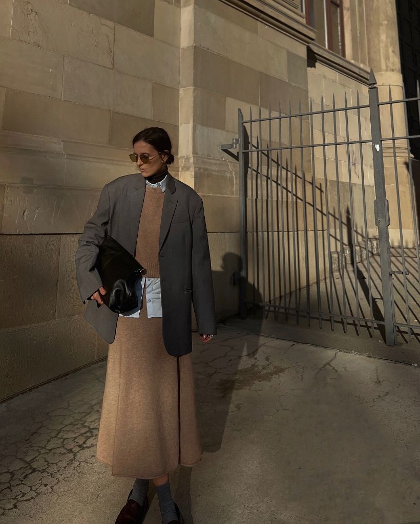 Camel knit midi skirt with grey oversized blazer and brown loafers