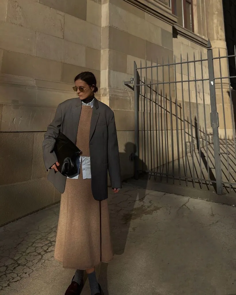 Camel knit midi skirt with grey oversized blazer and brown loafers
