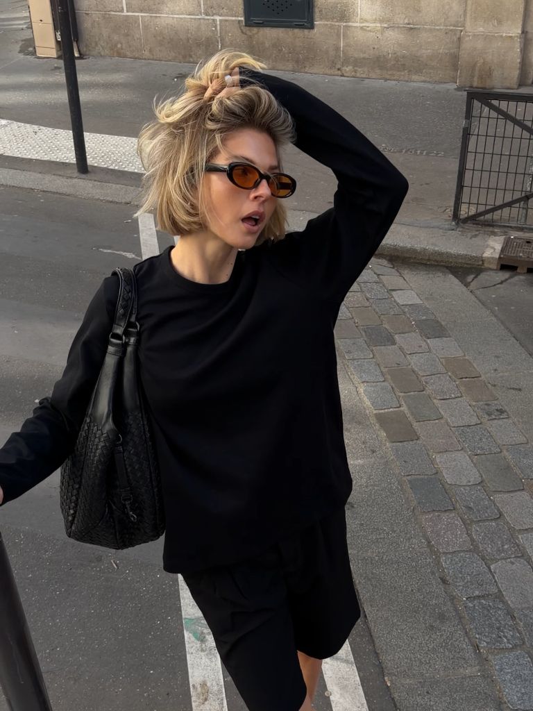 Fall professional outfit all black oversized knit with woven bag