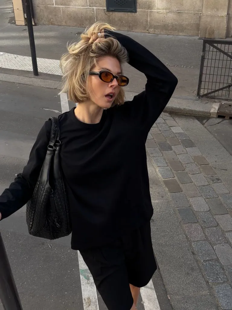 Fall professional outfit all black oversized knit with woven bag