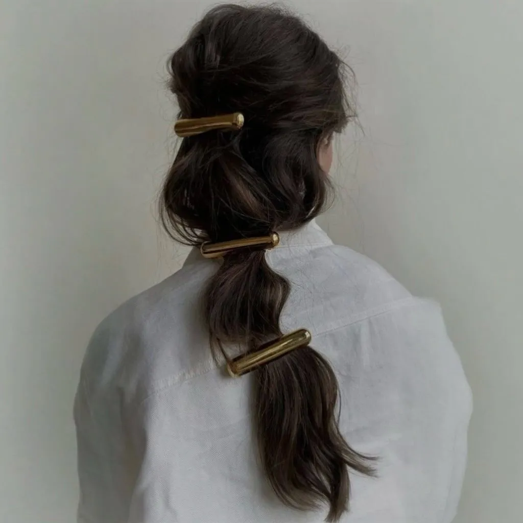 Fall Hairstyles for Office 2026 Segmented Ponytail with Gold Barrettes