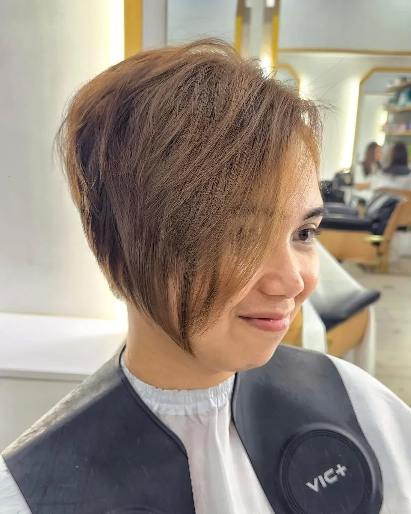 Fall hairstyles for short hair 2026 Layered Short Bob with Long Side-Swept Fringe
