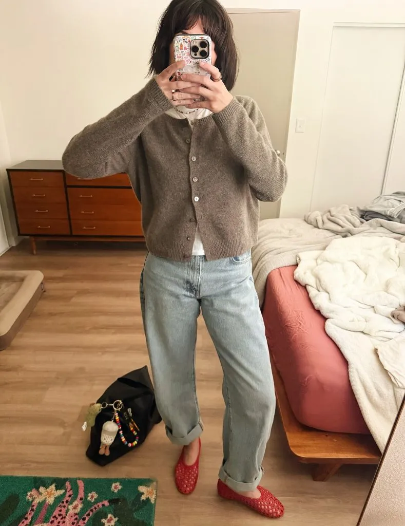 Mirror selfie in taupe cardigan and light wash jeans with red flats