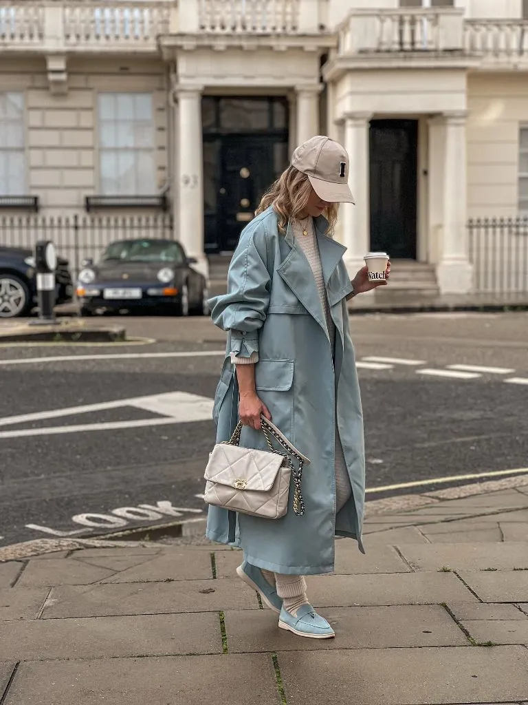 Dusty blue trench coat with knit set and Chanel quilted bag