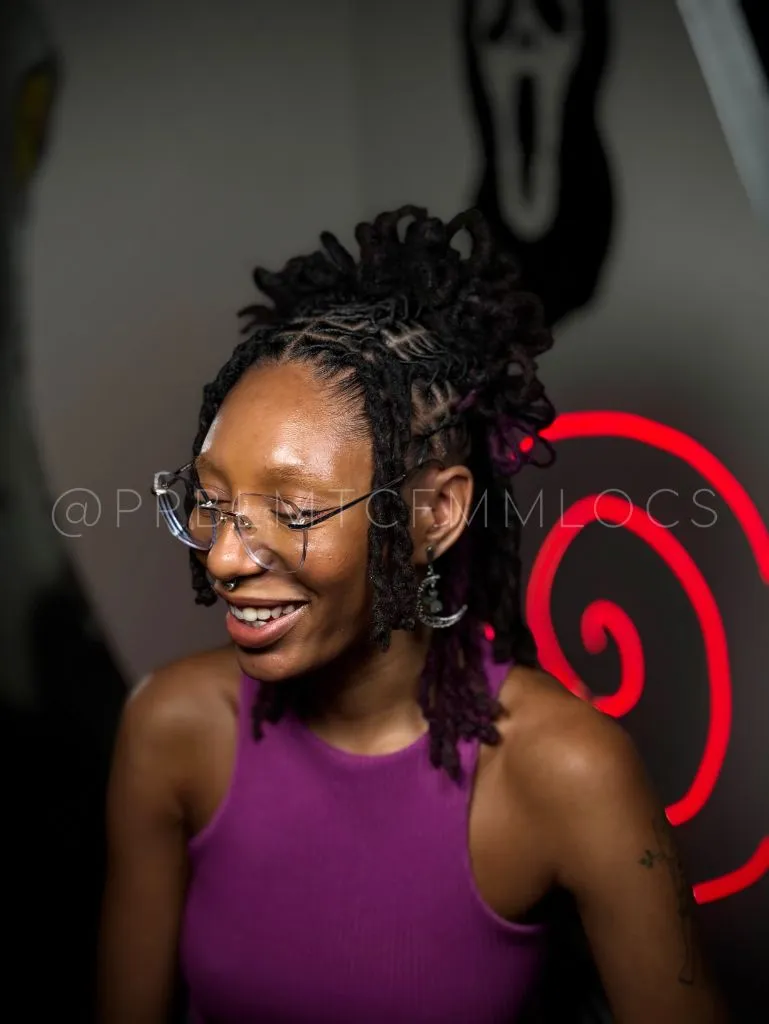 Locs Hairstyles for Black Women Edgy Loc Ponytail With Purple Peekaboo Tips