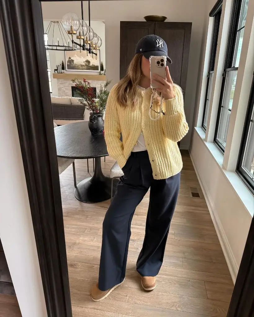 Mirror selfie with yellow cardigan and navy trousers