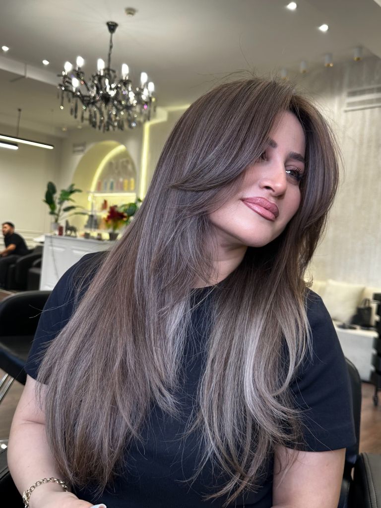 Long straight ash brown hair with cool silver undertones