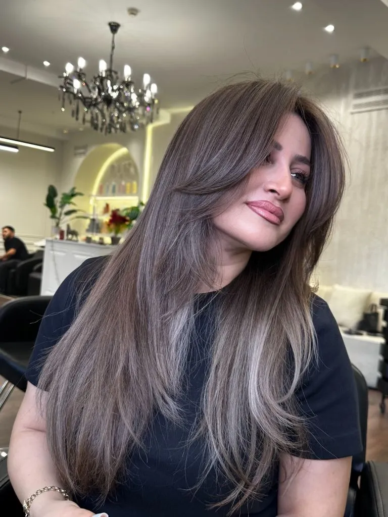 Long straight ash brown hair with cool silver undertones