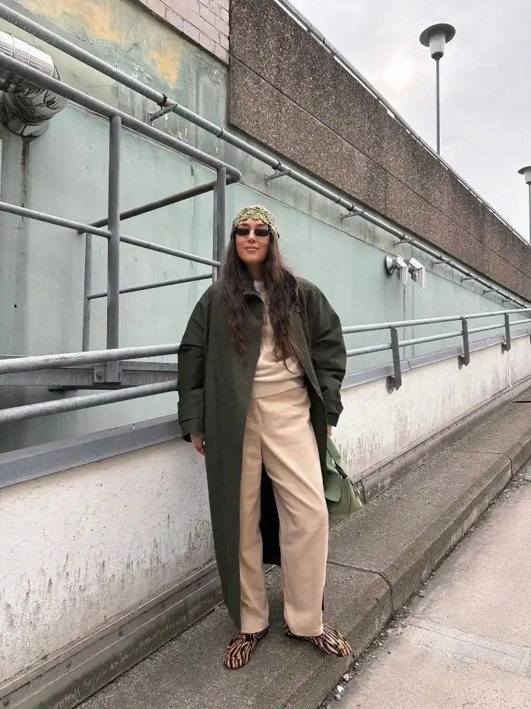 Olive overcoat with beige outfit