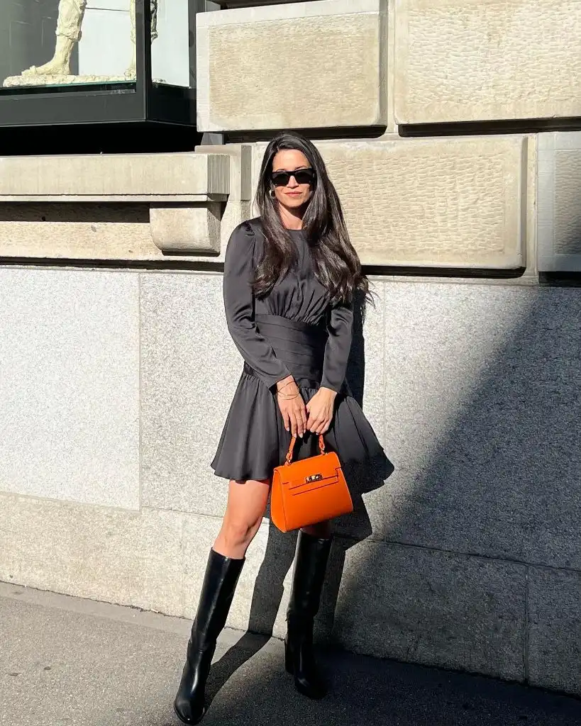 Fall Date Night Outfit - Black Mini Dress with Orange Bag and Knee Boots