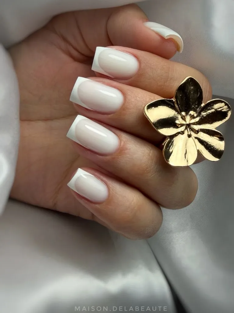 Elegant square French manicure with milky white base on medium nails August nails color 2026 ideas