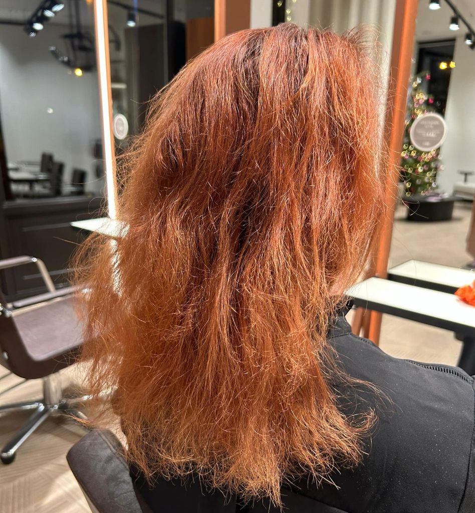 Fall Haircuts for Women 2026 Fiery Copper Waves with Undone Texture and Movement