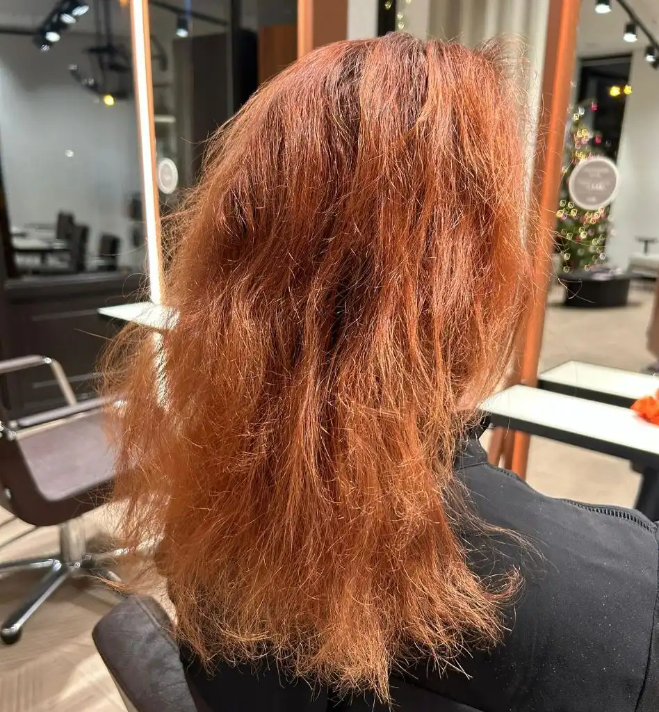 Fall Haircuts for Women 2026 Fiery Copper Waves with Undone Texture and Movement