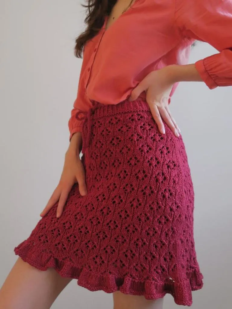 Hot pink lace-knit A-line skirt with coral blouse