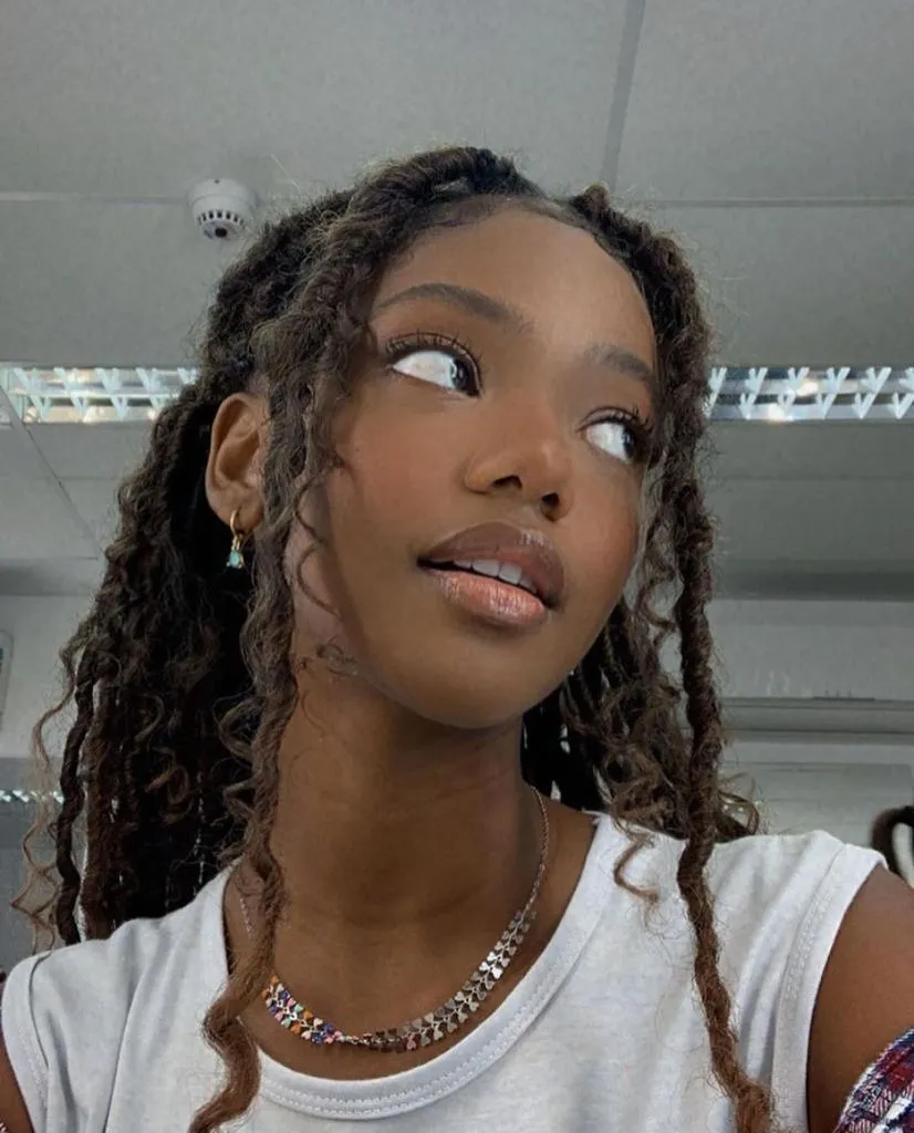 Fall Hair Colors for Black Women 2026 Warm Honey-Brown Locs With Soft Curled Ends