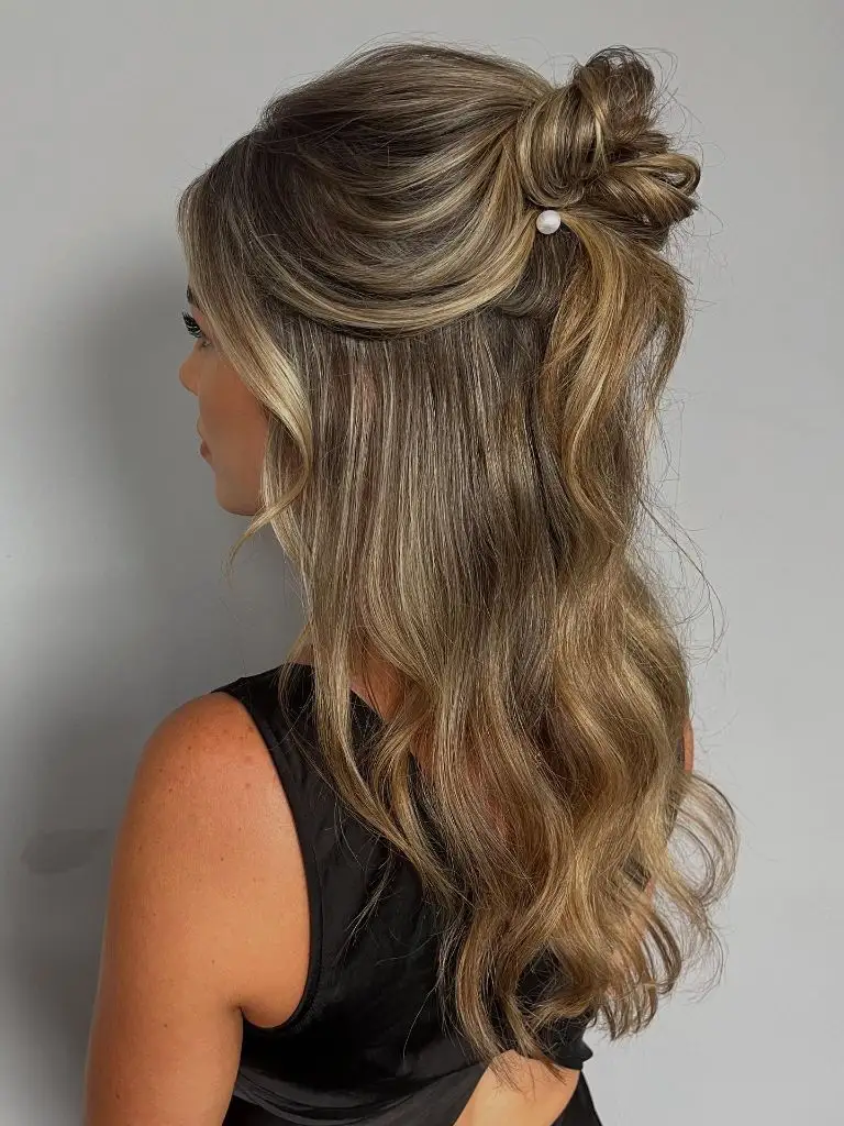 Fall Hairstyles for Wedding Guests 2026 Half-Up Topknot with Cascading Waves
