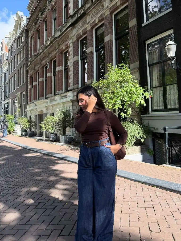 Brown top with dark jeans in Amsterdam