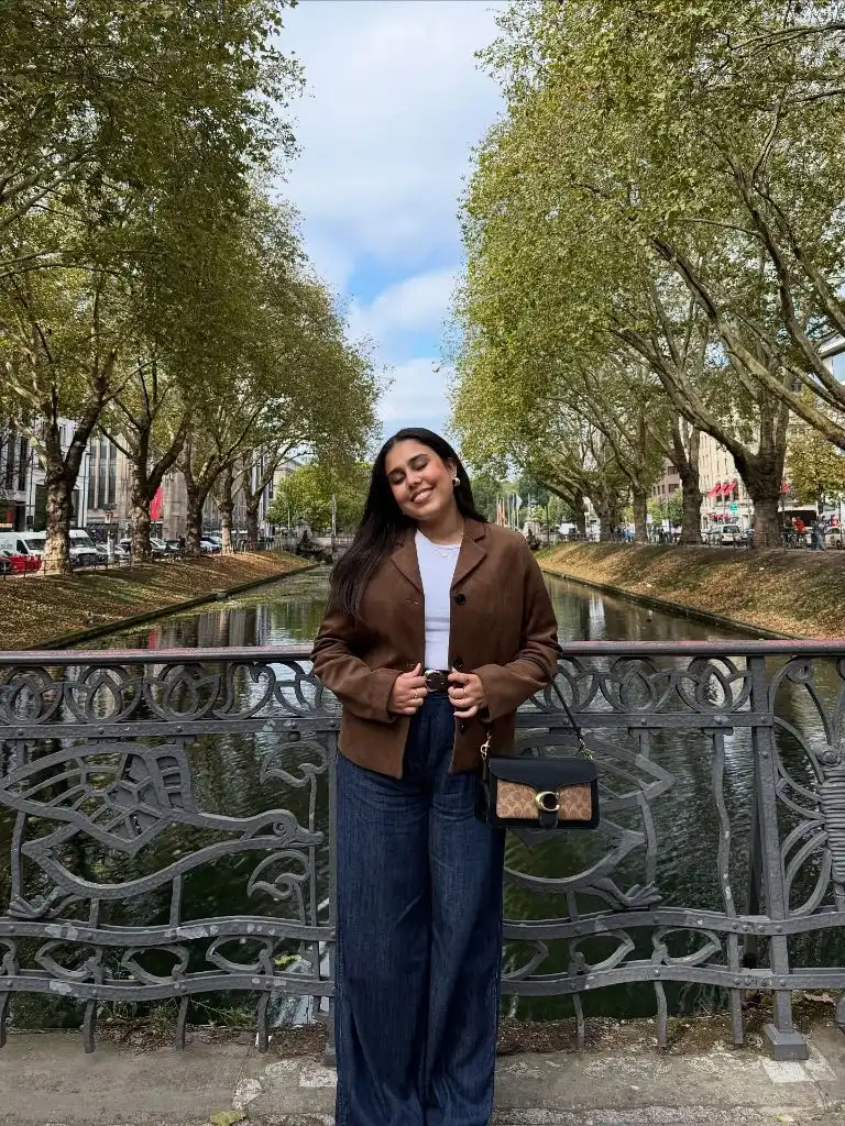 Brown jacket outfit on bridge