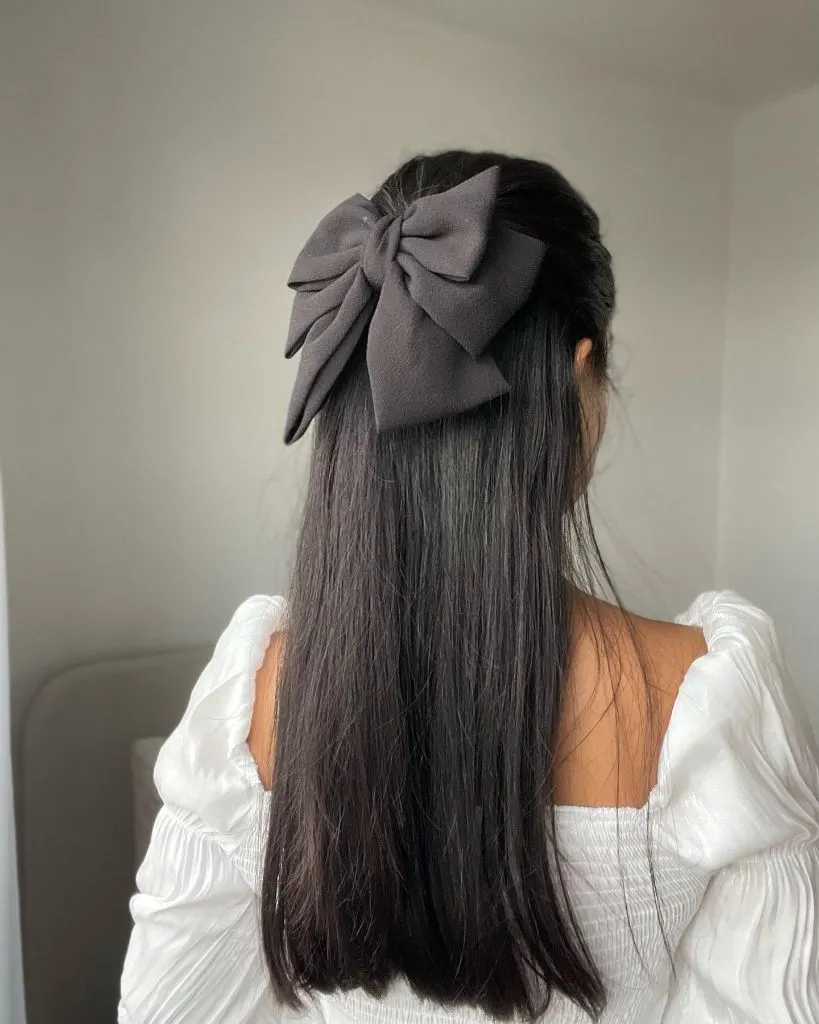 Fall Hairstyles for Long Hair 2026 Sleek Jet-Black Half-Up With Statement Black Bow