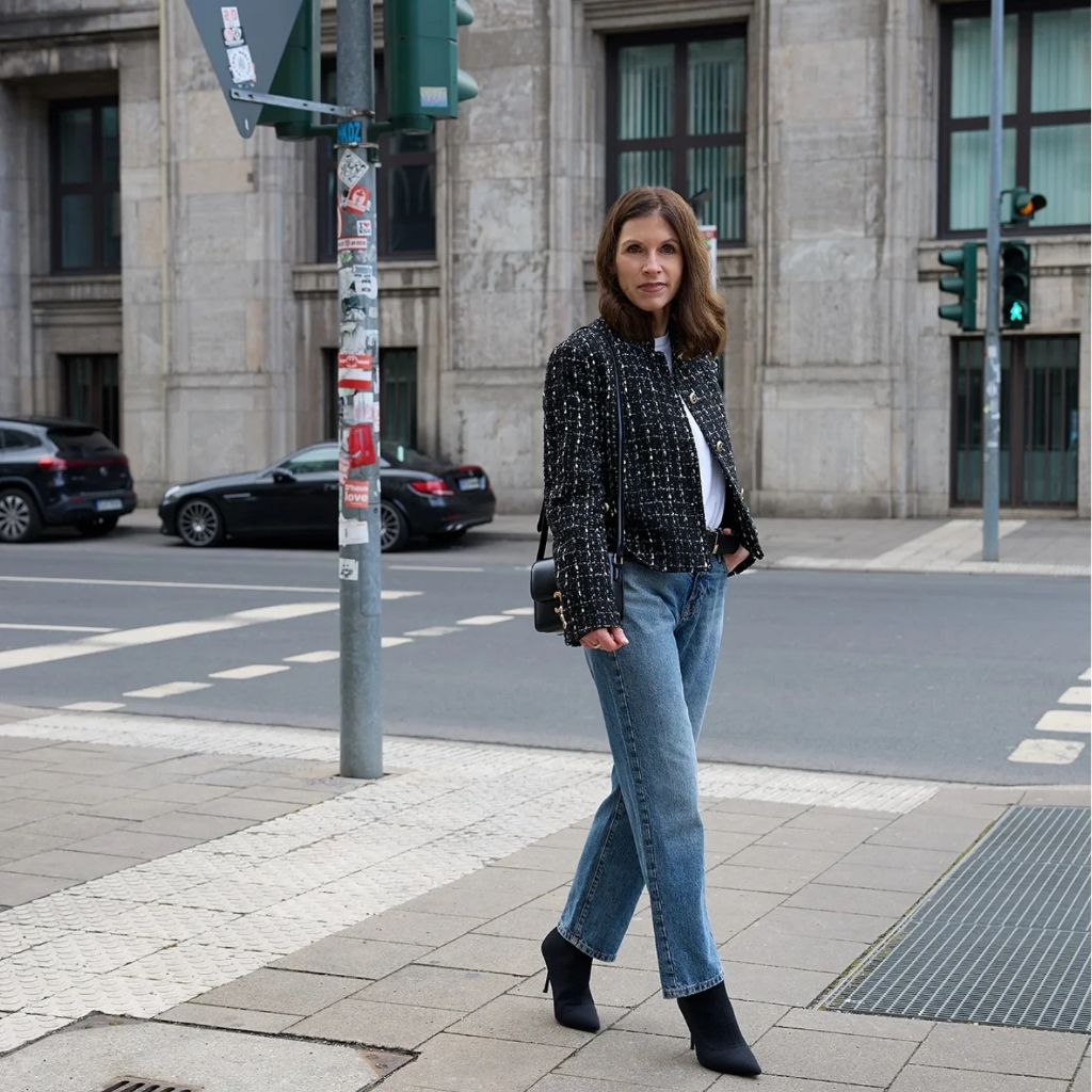 Black tweed jacket with white tee and straight-leg jeans