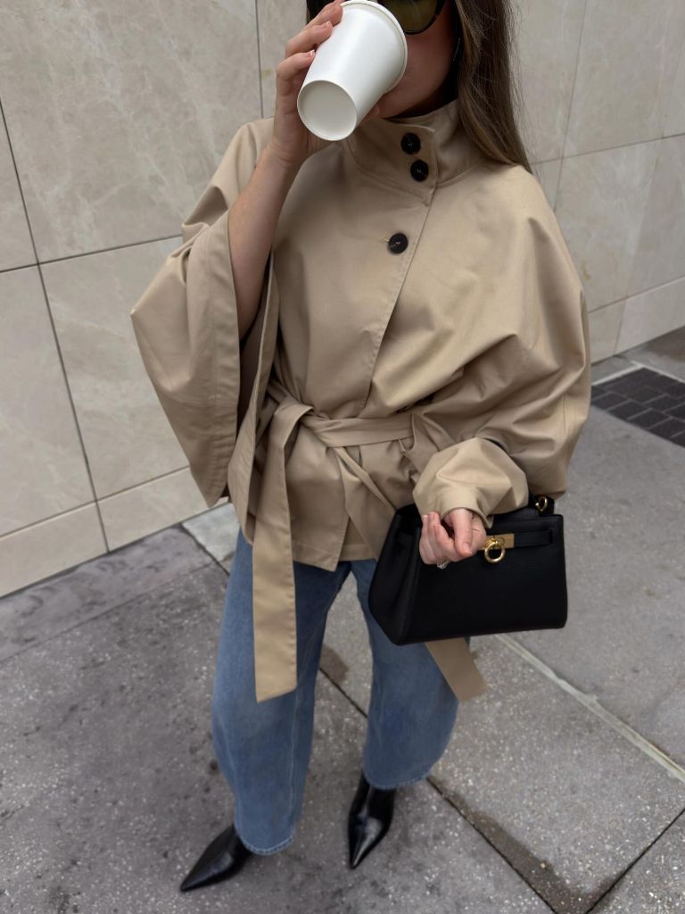 Beige cape-style belted peacoat with jeans and pointed boots