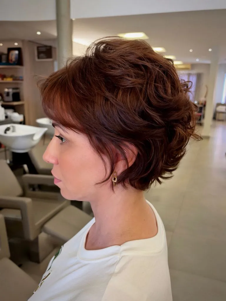 Fall Short Haircuts 2026 Curly Auburn Pixie Bob with Retro-Inspired Volume