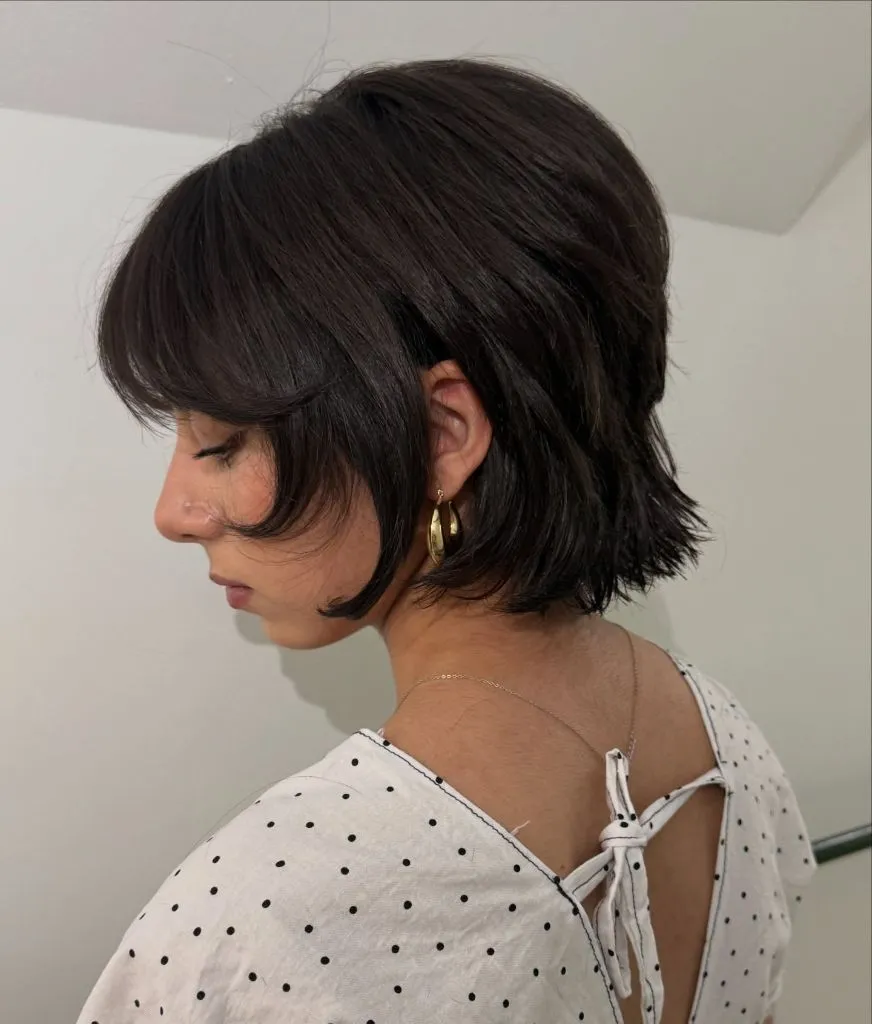 Fall hairstyles for short hair 2026 Textured Dark Shag Bob with Full Bangs