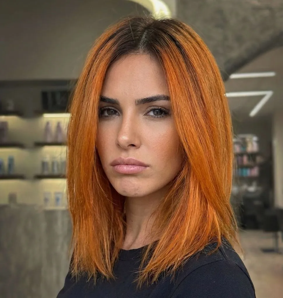 Fall Medium Haircuts 2026 Fiery Copper Lob with a Wet-Look Center Part