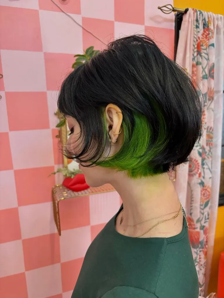Bobbed Haircut for Women Edgy Black Bob with Hidden Neon Green Peekaboo Color