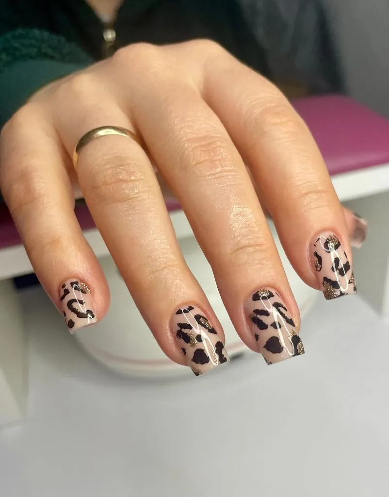 Color First Fall Manicure 2026 Cow Print Short Square Nails With Gold Glitter Accents
