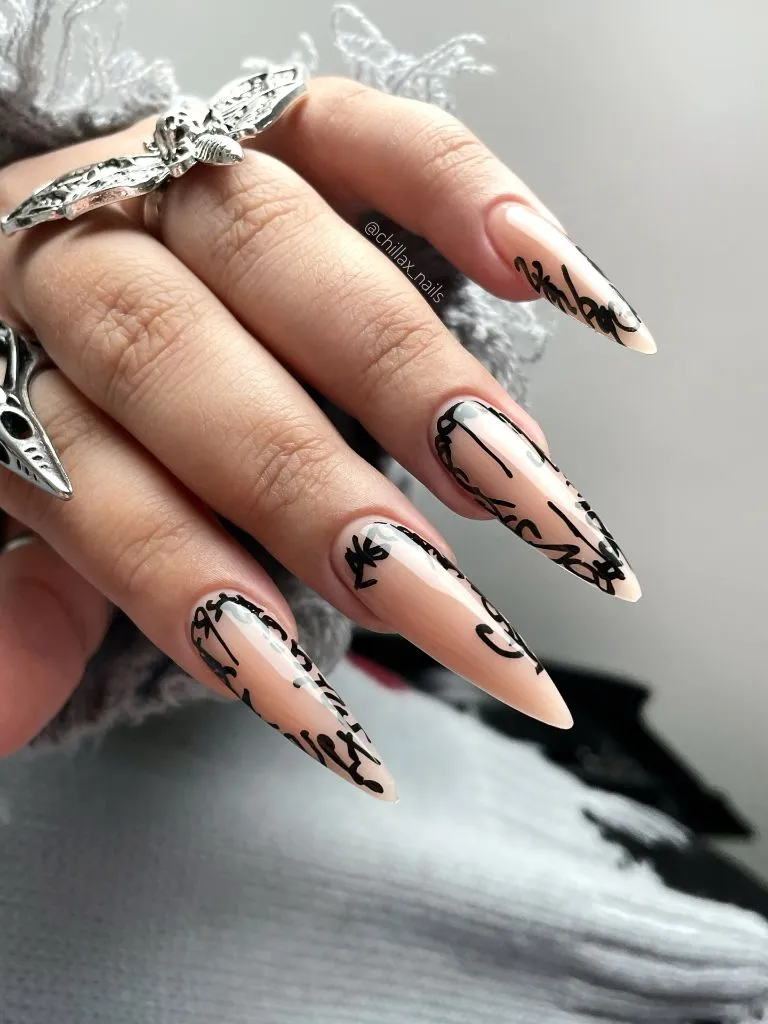 Fall Nail Inspiration 2026 Nude Stiletto Nails With Black Script Art