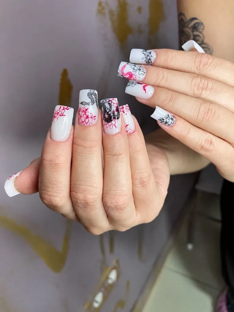Color First Fall Manicure 2026 White Base Nails With Red Floral And Black Snake Art