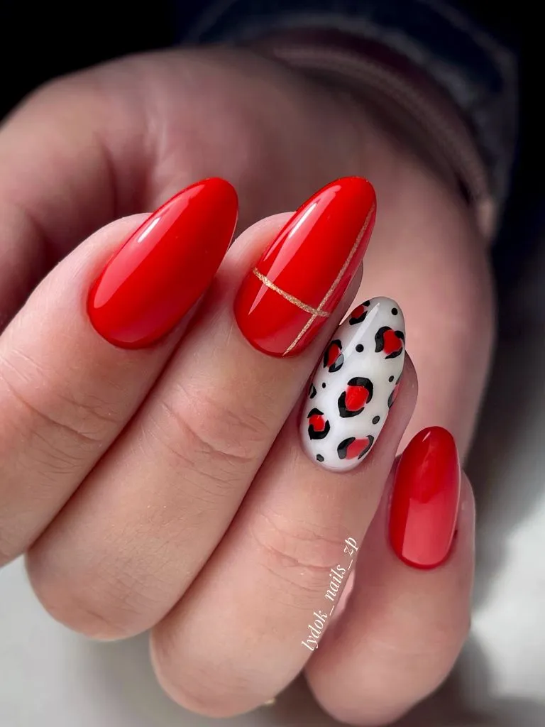 Fall Nail Inspiration 2026 Red Oval Nails With Leopard Accent and Gold Line