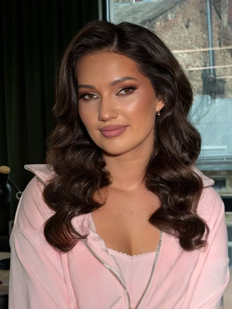 Middle Parting Hairstyles Chocolate Waves With A Pink Zip-Up And Centre Part