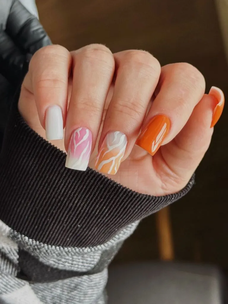 Color First Fall Manicure 2026 White And Orange Gradient Swirl Nails