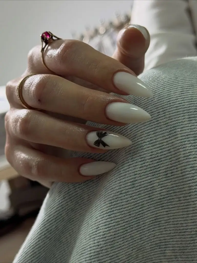 Fall Nail Inspiration 2026 White Almond Nails With Black Bow Accent