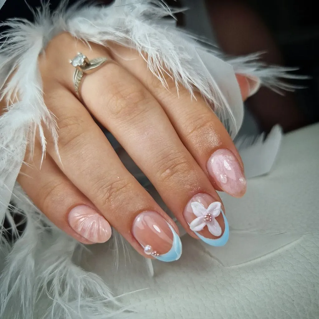 Fall Nail Colors for Dark Skin Soft Blue French Tip Oval Nails With A 3D White Flower