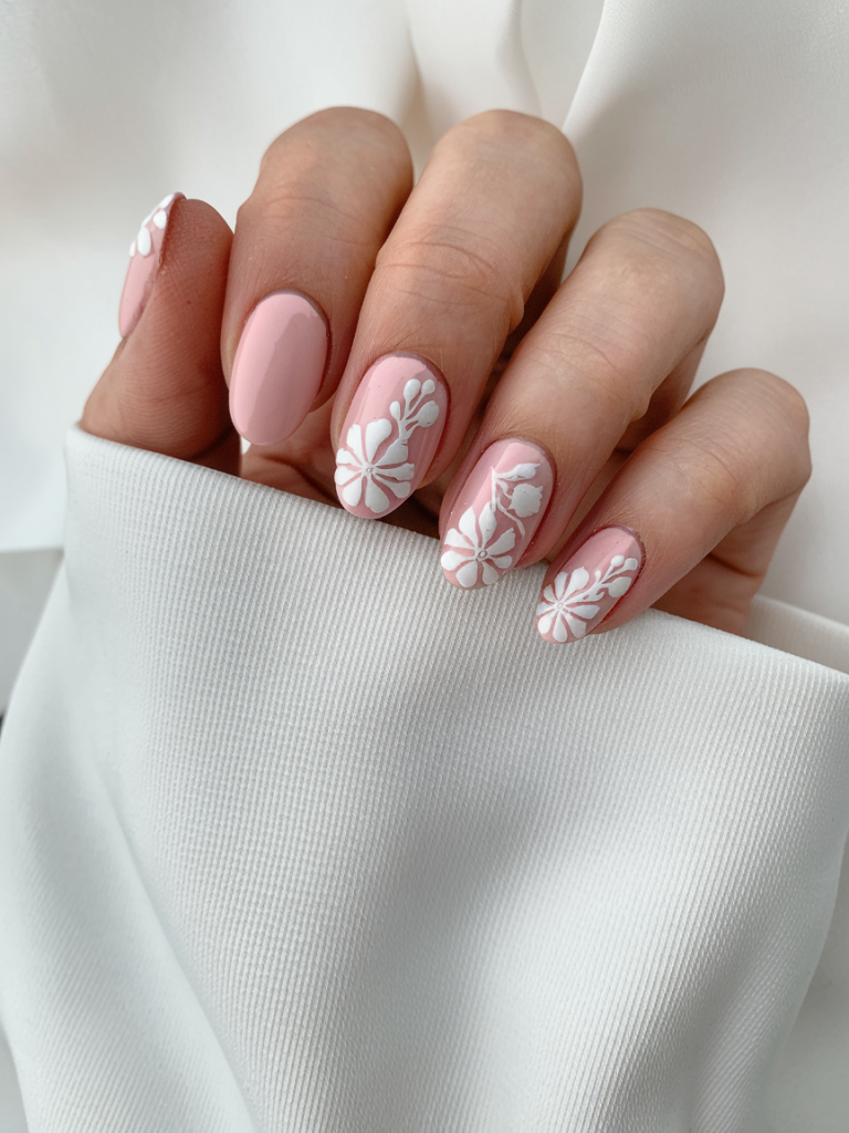 Dusty pink nails with delicate white floral nail art