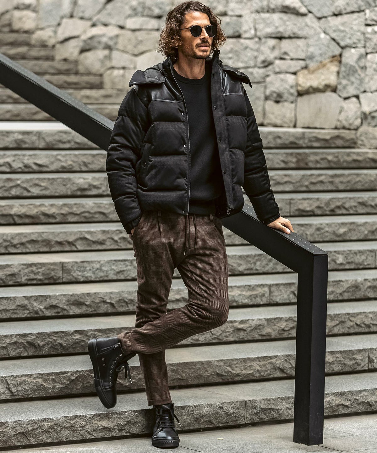 Man wearing a minimalist winter coat with simple layered outfit