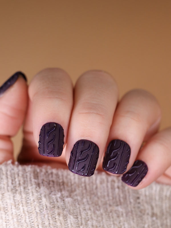 Deep plum matte nails with sweater-knit pattern
