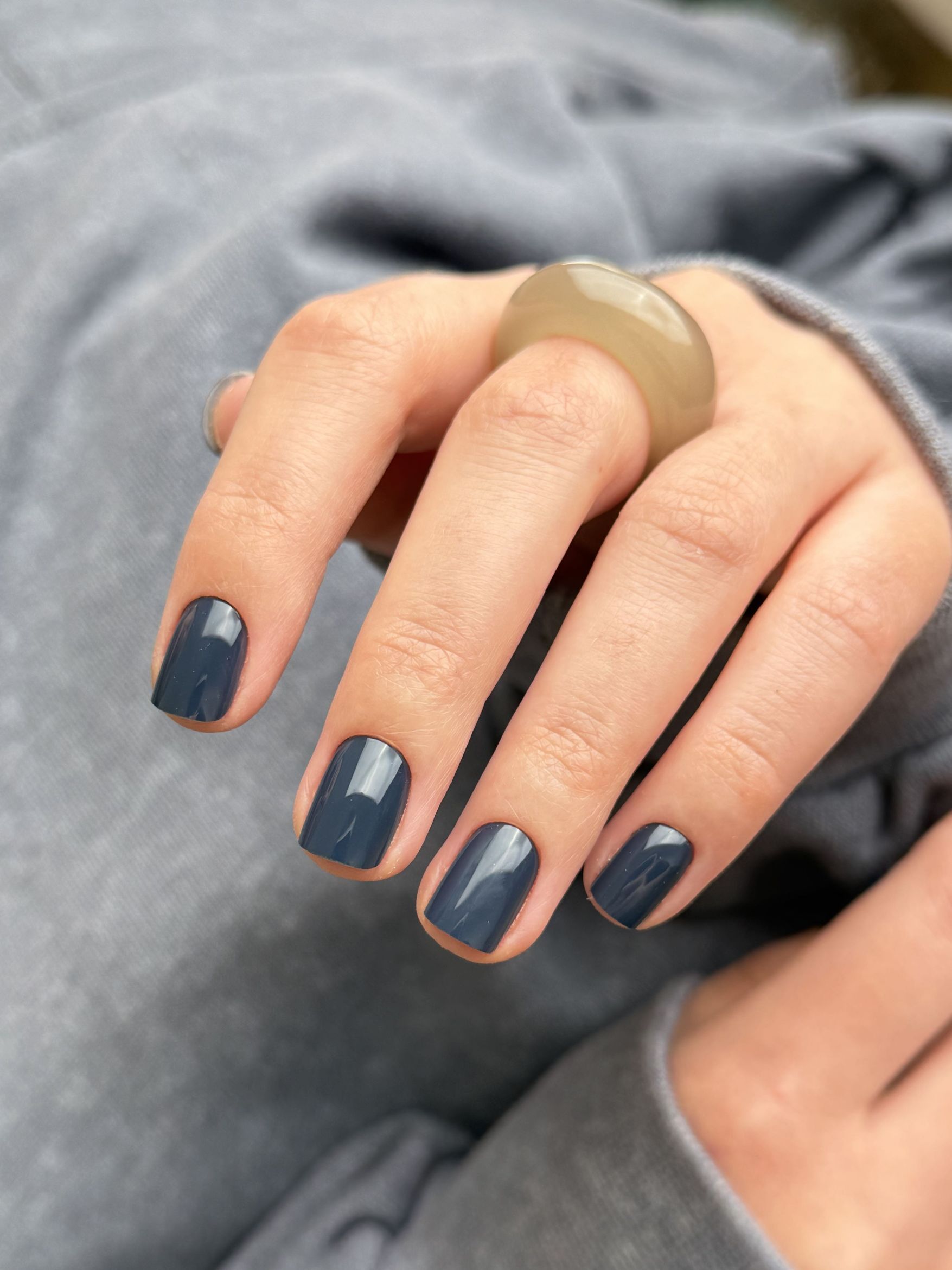 Short nails in a dusty grayed-out slate blue shade