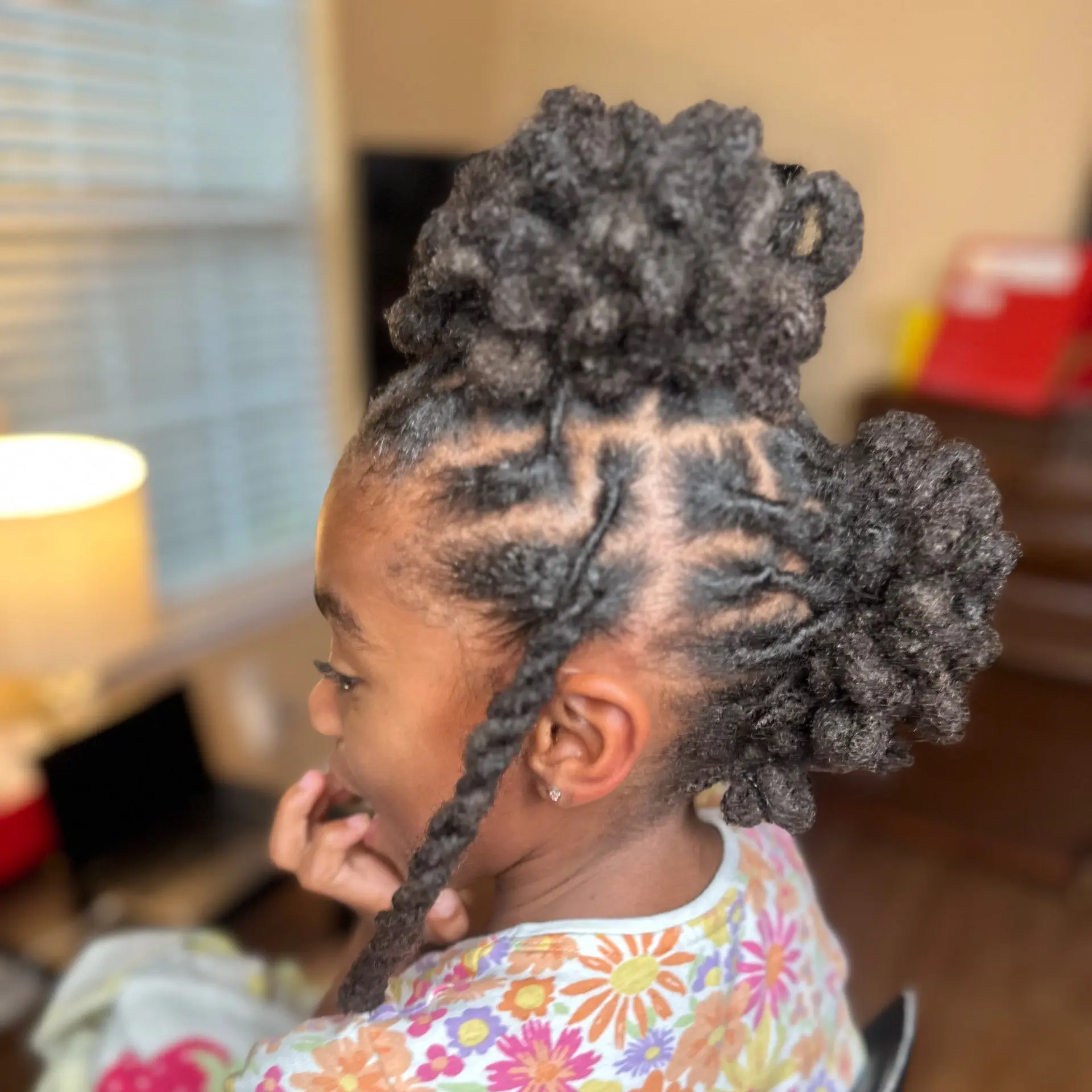 Twisted updo hairstyle on a Black child