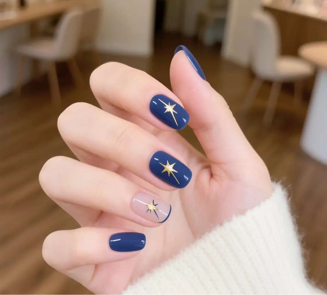 Short square navy nails with tiny gold star nail art
