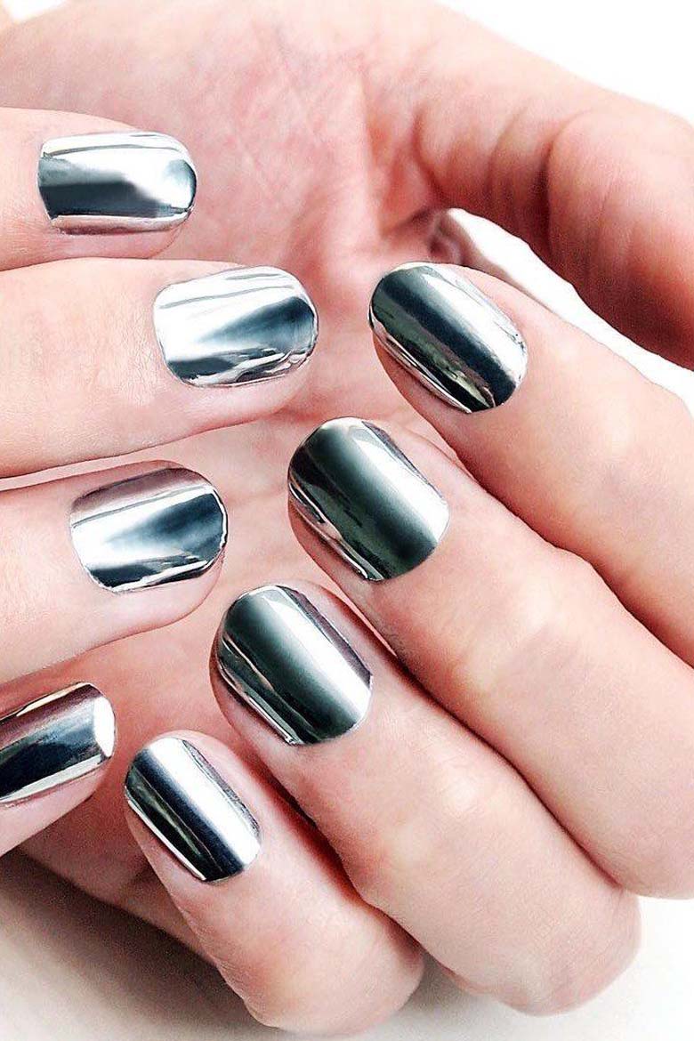 Short squoval nails with a mirror-like silver chrome finish.