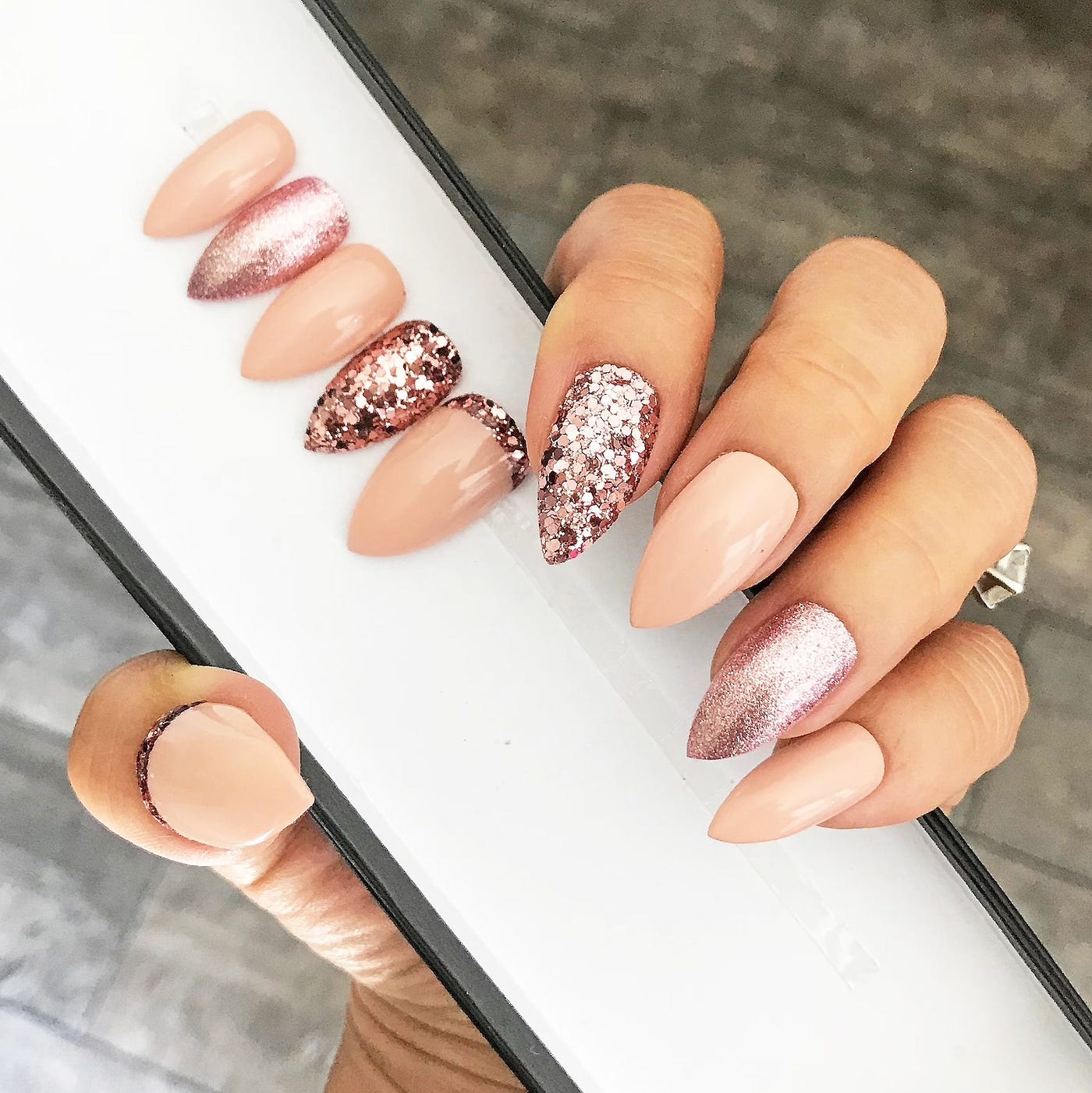 Nude stiletto nails with rose gold glitter accent nails