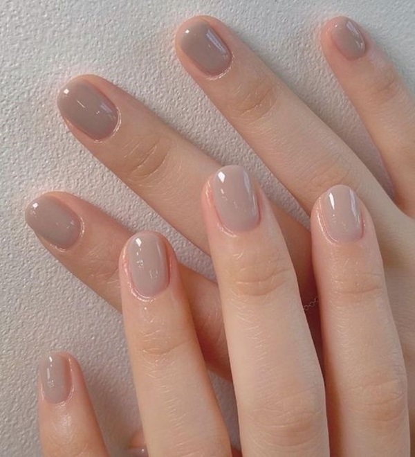 Short oval nails in a soft greige gray-beige polish