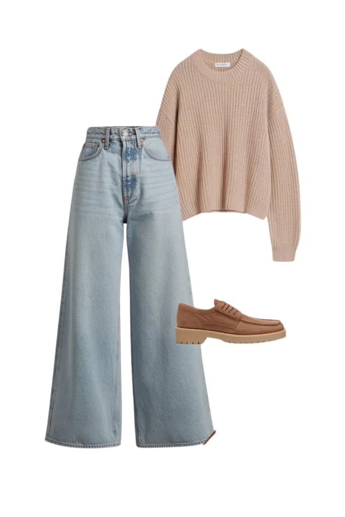 Flat-lay of a beige oversized knit sweater with light-wash wide-leg jeans and tan suede loafers