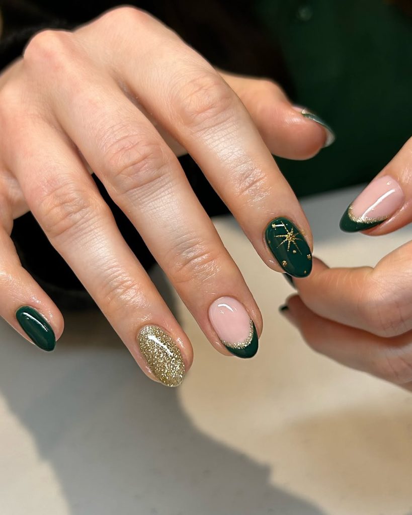 Oval nails mixing solid emerald green, gold glitter French tips and gold starburst nail art