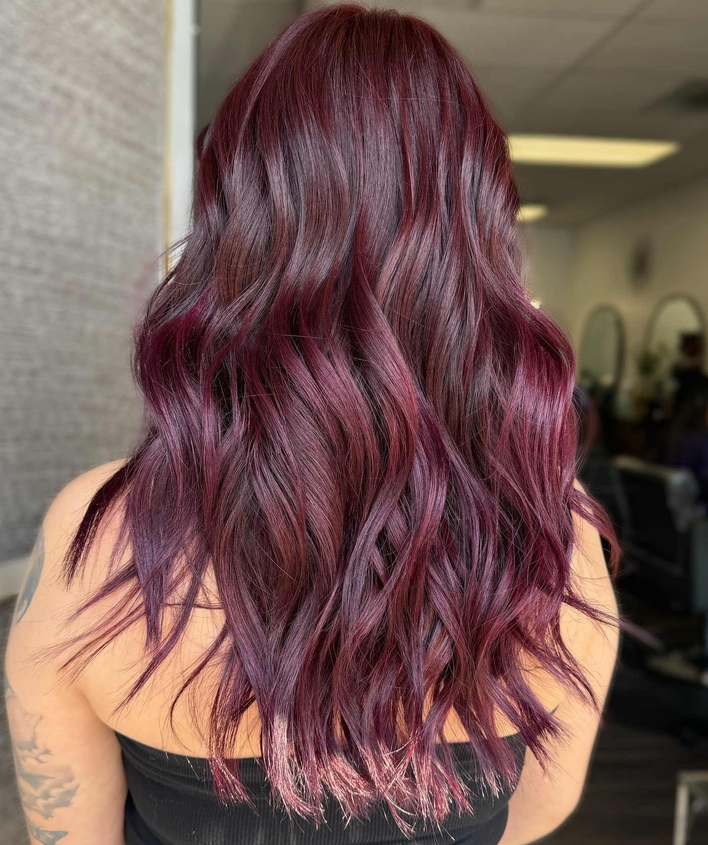 Black cherry cola hair color on sleek long hair
